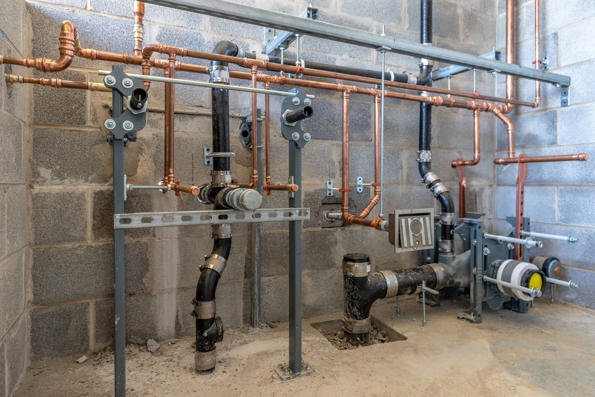 Plumbing rough-in for a new commercial bathroom